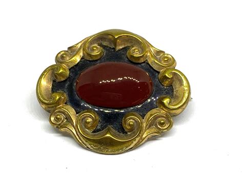 Lot A Victorian Pinchbeck Carnelian Black Enamel Mourning Brooch