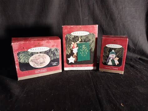 THREE HALLMARK KEEPSAKE ORNAMENTS | EstateSales.org