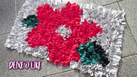 A Close Up Of A Rug On The Floor With Red White And Green Flowers