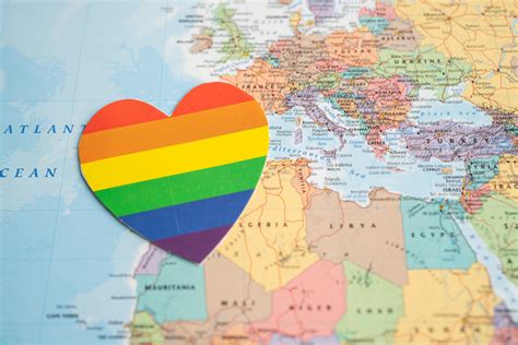 Rainbow Color Heart On Globe World Map Background Symbol Of Lgbt Pride