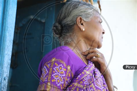 Image Of Indian Old Woman Of A Rural Village Standing At Her House Door