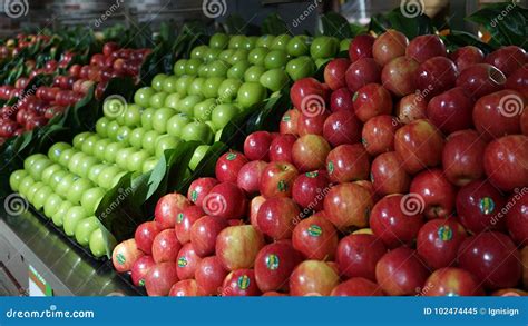 Apple Selection Aisle With Sections Of Red And Green Apples In