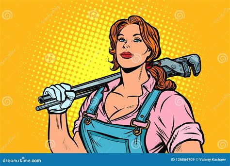 A Strong Woman Mechanic Plumber Worker With Adjustable Wrench Stock