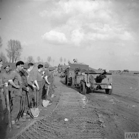 Royal Engineer Sappers Watch 25 Pdr Field Guns Being Towed Towards