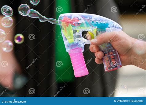 Closeup of Bubble Gun Toy Shooting Bubbles Stock Photo - Image of holding, closeup: 39403018