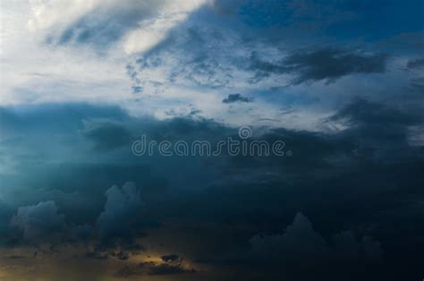 Storm Clouds Against a Bright Blue Sky. Stock Image - Image of ...