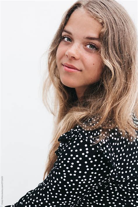 Portrait Of A Pretty Blonde Teen With Green Eyes And Freckles By