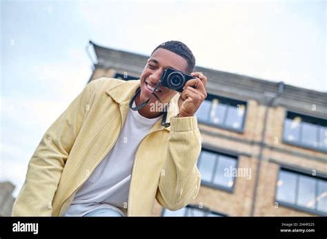 Man Looking Through Camera Lens Outdoors Stock Photo Alamy