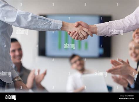 Business womans handshake Stock Photo - Alamy