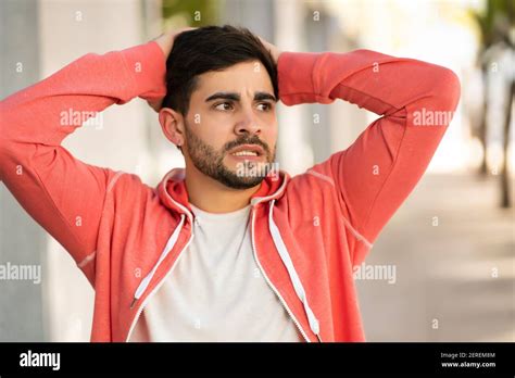young man  stressed  worried outdoors stock photo alamy