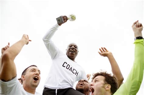 Premium Photo | Football players celebrating their victory