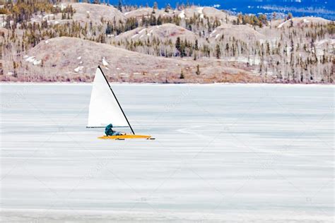 Ice-boat sailing frozen Lake Laberge Yukon Canada Stock Photo by ©PiLens 77602734