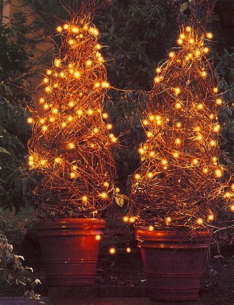 how to decorate grapevine tree | Once the cage is anchored in place you can weave prunings from ...