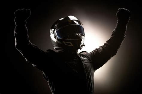 Premium AI Image | Silhouette of race car driver celebrating the win