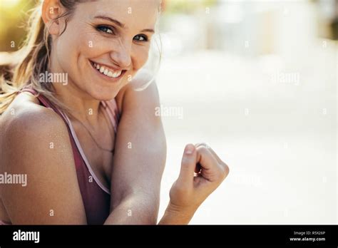 Close Up Of A Female Athlete Stretching Her Arms Doing Warm Up