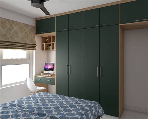 Spacious Dark Green Hinged Wardrobe Design With Lofts And Study Unit