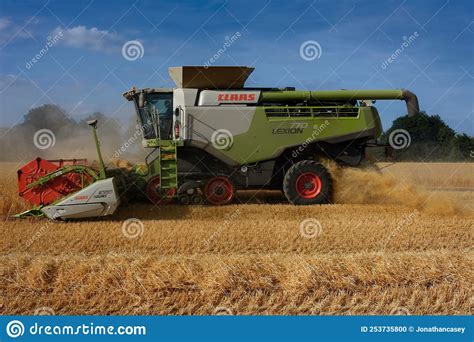 Side View Of Combine Harvester Harvesting Barley In Norfolk Editorial