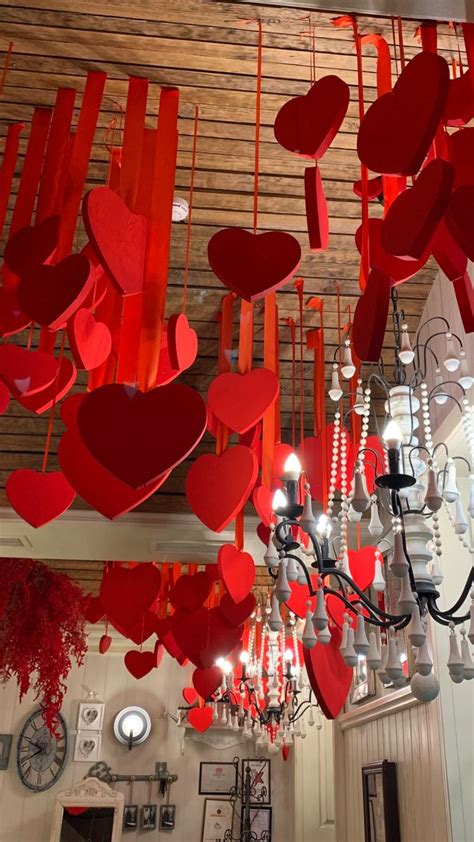 Red Hearts Hanging From The Ceiling And Chandelier