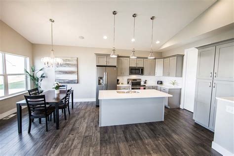 Elegant kitchen with painted gray cabinets and GE Slate appliances ...