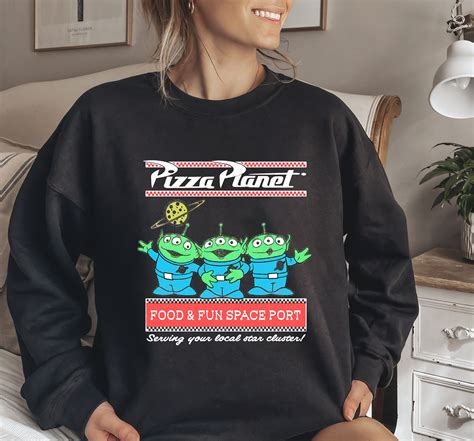 Disney Pixar Aliens Pizza Planet Pastel Logo T-Shirt Designed & Sold By Cartmax