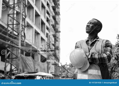 Thoughtful Young Black African Man Construction Worker Holding