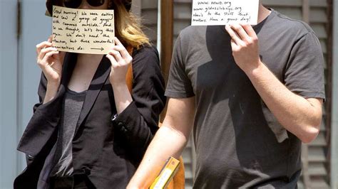 Emma Stone Andrew Garfield Hold Signs To Redirect Paparazzi Attention