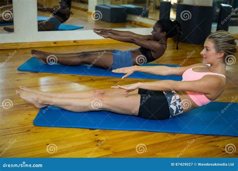 Two Fit Women Doing Stretching Exercise On Mat Stock Image Image Of