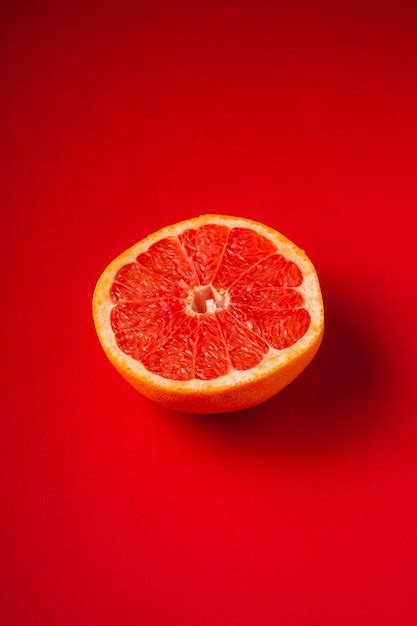 Premium Photo Close Up Of Strawberry Against Red Background