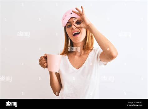 Beautiful Redhead Woman Wearing Sleeping Mask Drinking A Cup Of Coffee