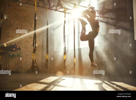 Perfect Flexibility Full Length Of Athletic Woman In Black Sport