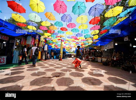 people walk   colorful umbrella shaded market  dilli hat