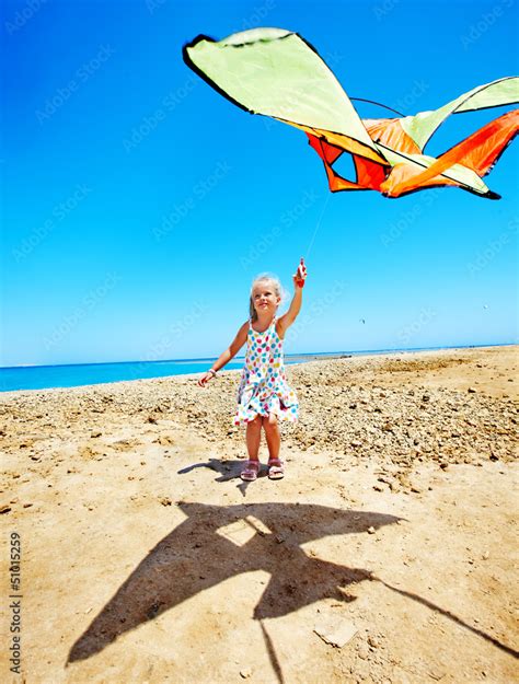 Kid flying kite outdoor. Stock Photo | Adobe Stock