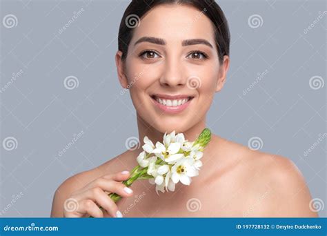 Portrait Of A Beautiful Smiling Brunette Woman With Naked Shoulders