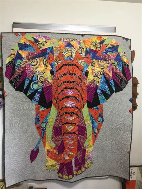 An Elephant Is Made With Colorful Fabrics On The Wall