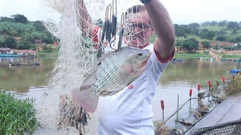 PESCARIA DE TARRAFA NA LAGOA CONFERINDO O TAMANHO DOS PEIXES DOS