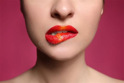 Young Woman With Beautiful Makeup Biting Lip On Pink Background Closeup Stock Image Image Of