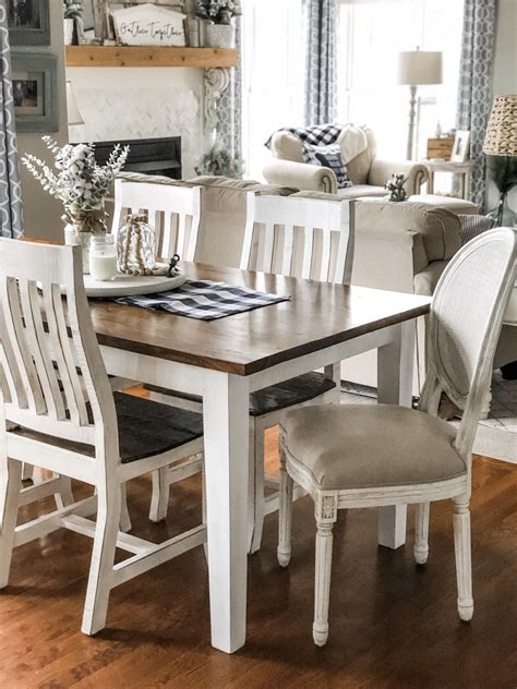 Classic farmhouse table with dark top and white chairs for that perfect ...