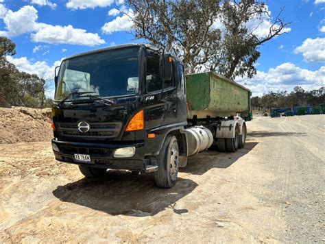 Lot 16 HINO FM TRUCK AND 15 TONNE HOOK LIFT BIN AuctionsPlus