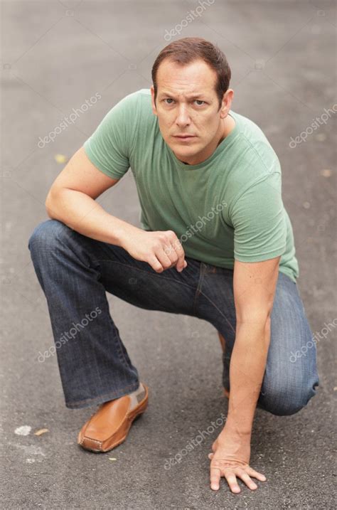 Man Kneeling Stock Photo Felixtm 5463327