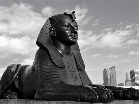 Sphinx statue near modern city · Free Stock Photo