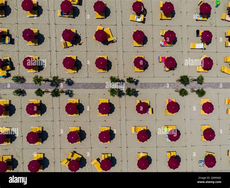 Aerial view of the sandy beach with umbrellas Stock Photo - Alamy