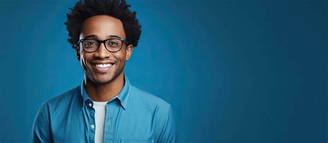 Portrait Of A Smiling African American Man Wearing Glasses Posed