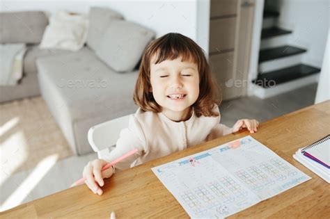 Portrait of preschooler girl with open mouth without milk tooth ...