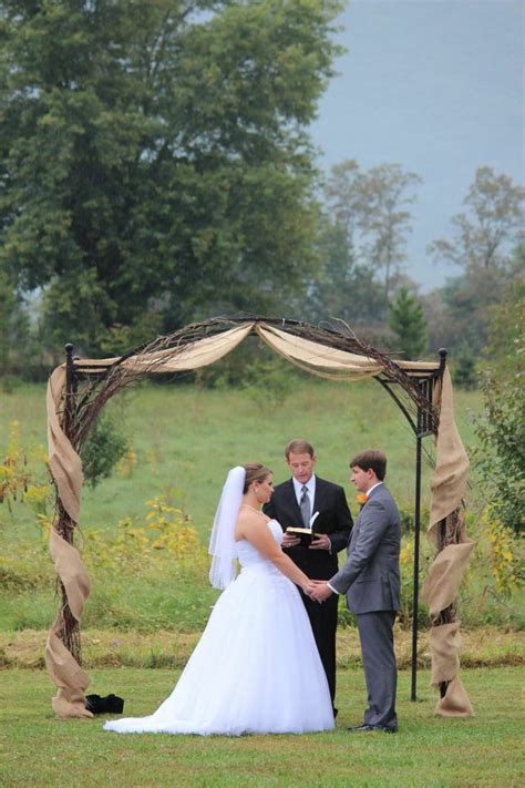 Ashley And Mike Decorated Their Arbor With Burlap Runners Khimaira Farm Outdoor Barn Wedding