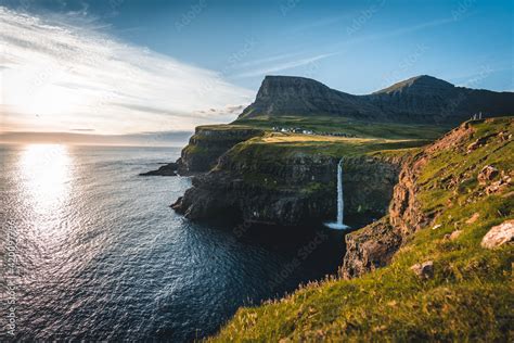 Gasadalur Village And Mulafossur Its Iconic Waterfall During Summer