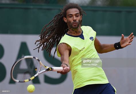 Dustin Brown Of Germany Returns A Shot During His Mens Singles Match