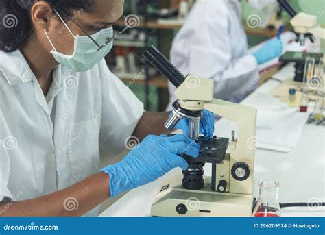 African American Scientist Man Look Into Microscope Research In Science