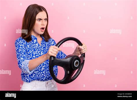 Photo Of Impressed Unsatisfied Person Arms Hold Wheel Look Empty Space Isolated On Pink Color