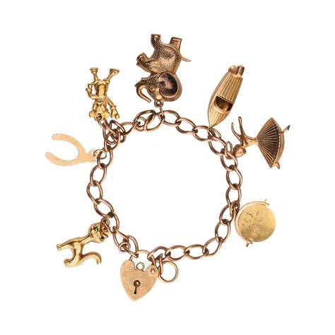 9CT GOLD CHARM BRACELET