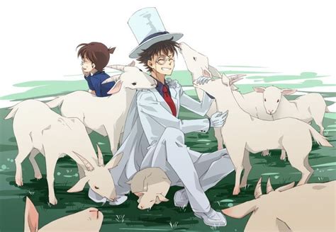 A Man In A White Suit And Top Hat Standing Next To Some Sheep With One